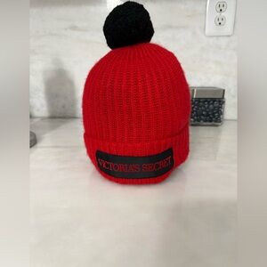 Chic Red Victoria's Secret Knit Beanie with Black Pom Pom